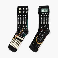 a pair of black socks with musical instruments on the front and back sides, all in different colors