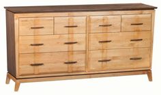 a wooden dresser with several drawers on one side and an open drawer on the other