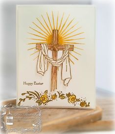 a card with a cross and flowers on it