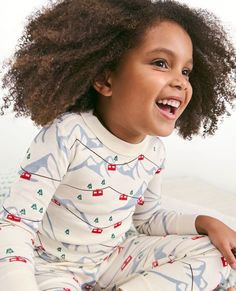 Long John pajama set in our legendary soft organic cotton rib knit, complete with cheerful holiday print fit for every festive moment. • Hypoallergenic & eczema-friendly • Sensory-friendly scratch-free seams that lay flat on the skin • Like new wash after wash • OEKO-TEX® STANDARD 100 certified safe from hundreds of harsh chemicals 100% organic combed cotton rib knit Super-smooth flatlock seams Encased elastic waistband Foldable cuffs for a lasting fit OEKO-TEX® STANDARD 100 | 03.U.9375 HOHENSTE Playful Crew Neck Winter Sets, Playful Winter Sets With Crew Neck, Cotton Christmas Bedtime Tops, Christmas Cotton Bedtime Tops, Playful Winter Loungewear Sets, Playful Long Sleeve Sleepwear For Holidays, Playful Long Sleeve Holiday Sets, Playful Cotton Sleepwear For Winter, Holiday Playful Sleepwear