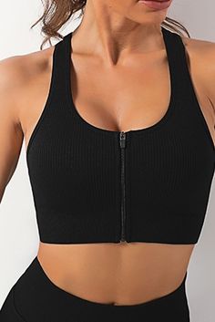 Black Zipped Ribbed Racerback Sports Bra Sporty Black Activewear With Zipper Closure, Black Sportswear Activewear With Zipper Closure, Black Stretch Activewear With Zipper Closure, Solid Activewear With Zipper Closure For Gym, Solid Activewear With Zipper Closure For Workout, Solid Color Activewear With Zipper Closure For Gym, Active Top, Racerback Sports Bra, Toned Body