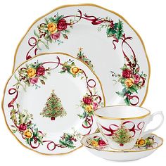 christmas dinnerware set with holly and roses on the plate, cup and saucer