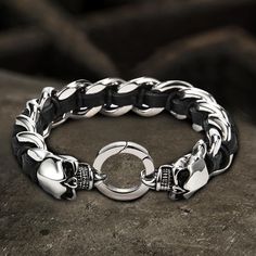 This motorcycles skull bracelet has a strong design sense, the combination of stainless steel and... Black Metal Skull Ring For Streetwear, Silver Skull Leather Bracelet In Punk Style, Punk Silver Leather Skull Bracelet, Silver Skull Punk Leather Bracelet, Black Punk Skull Ring For Biker Events, Black Skull Ring For Biker Events, Black Biker Style Bracelets For Biker Events, Punk Stainless Steel Bracelets For Streetwear, Edgy Metal Skull Bracelets