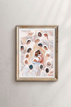 a painting hanging on the wall with many people around it and one person holding a baby