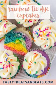 rainbow cupcakes with white frosting and sprinkles