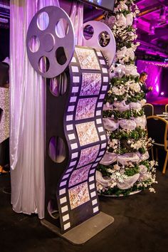 a christmas tree is decorated with film reels