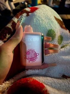 a hand holding a pink and green cell phone with the words geek bar on it