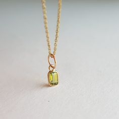 ✪Gold weight: 200 milligram ✪Stone size: 5x3 mm ✪Bail size: 5.2 mm ✪Without bail: 9.4 mm ✪Metal: 18k solid yellow gold ✪Gemstone: Peridot ✪Setting type: Bezel setting If you need any other preferred stone please contact us. QUALITY OF MATERIALS: Metal: Most of our jewelry at JewelryMansion is made with precious metals like gold and silver. These metals are 100% non-allergic to our skin. Gemstone: All of our jewelry is made by handpicked gemstones. Due to the nature of these gemstones a slight variation in colors may be noticed between the pictures and the real piece. Although we guarantee that this is barely noticeable. Real gemstones naturally consists of inclusions. In other words these gemstones may have very small barely noticeable cracks trapped inside the stones. This characteristics Gold Pendant Gemstones As A Gift, 14k Gold Pendant Gemstone For Gift, Yellow Gold Peridot Necklace Gift, Gold 14k Gold-filled Birthstone Charm Necklaces, Gold-filled Pendant Charms, August Birthstone, Gold Gift, Handmade Pendant, August Birth Stone