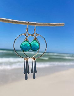 Gorgeous sea green Quartz, inspired by the emerald shores of the Gulf Coast. The perfect accessory for your summer wardrobe! Hand-shaped and hammered circle hoops. Triple hammered metal fringe Approximately 2.5 inches in length. 14kt Gold Filled or Sterling Silver Nickel-free Summer Jewelry, Green Hoop Earrings For Beach, Green Hoop Earrings For The Beach, Green Teardrop Jewelry For Summer, Green Hammered Bohemian Jewelry, Metal Hoop Earrings For Summer Beach, Summer Beach Metal Hoop Earrings, Summer Beach Circular Jewelry, Circular Summer Beach Jewelry