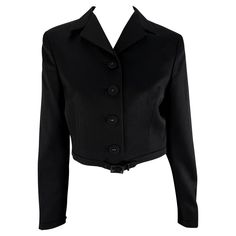 This chic black cropped jacket by Gianni Versace is from the Spring/Summer 1996 collection and debuted on the runway as part of Look 4, modeled by Amber Valletta. It features a foldover collar, fabric-covered button closures, and subtle buckle details at the waist and cuffs. Whether dressed up or down, this vintage Versace jacket is a versatile addition to any wardrobe. Approximate measurements: Size - IT40, US6 Shoulder to hem: 17” Bust: 35 - 36” Waist: 30” Shoulder to cuff: 23.5” Underarm to cuff: 17” 1996 Runway, Black Cropped Jacket, Versace Jacket, Versace Runway, Amber Valletta, Cropped Blazer Jacket, Vintage Versace, Belted Blazer, Cropped Blazer