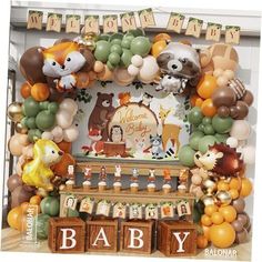 an animal themed baby shower with balloons and decorations