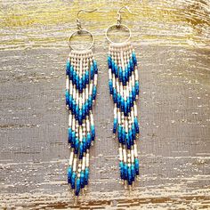 "These white and blue beaded Fringe Earrings are made with size 11/0 high quality seed beads, durable thread, Hypoallergenic earring hooks and silicone plugs.  They are incredibly lightweight while measuring 5\" (13 cm) long and 1\" (21mm) wide and weight 9 g. They will emphasize your individuality and compliment your personality on various occasions.  These seed beaded Fringe Earrings will go amazingly with any outfit, dressy or casual.  These beaded fringe earrings are lightweight and easy to wear for hours. Long Handmade seed bead fringe earrings, bohemian jewelry." Bohemian Turquoise Beaded Fringe Earrings, Elegant Blue Beaded Fringe Earrings, Bohemian Blue Earrings With Fringe, Southwestern Blue Beaded Fringe Earrings, Blue Bohemian Beaded Fringe Earrings, Blue Beaded Earrings, Large Necklace, Beaded Earrings Tutorials, Beaded Fringe