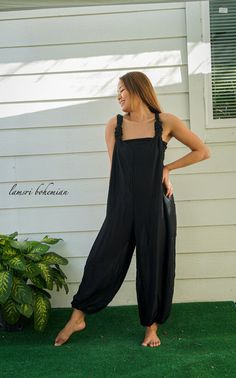 "🌈 Solid Black Hippie Jumpsuit, Racerback Romper, Hippie Clothing, Festival Clothing, Hippie Long Pants, Comfy Romper 👉 100% Comfy Rayon Material 👉 Adjustable Back Racerback Knot Style for Flexible Fit 👉 Elastic Ankles 👉 2 Side Pockets 👉 Great for lounging at home, doing art music, festival clothing or as a matching with your friends or family! 👉 Chic hippie style romper 👉 Length from high point of shoulder to hem: 54\" 👉 Elastic Ankles stretch 5\"-14\" 👉 Bust 35\"- 55\" 👉 Waist : 27\ Black Sleeveless Cotton Overalls, Black Relaxed Fit Wide Leg Jumpsuits And Rompers, Black Bib Front Jumpsuit For Spring, Black Overalls For Spring, Black Spring Overalls, Black Bib Front Jumpsuits And Rompers For Summer, Black Summer Jumpsuits And Rompers With Bib Front, Black Bib Front Jumpsuit For Summer, Black Summer Jumpsuit With Bib Front