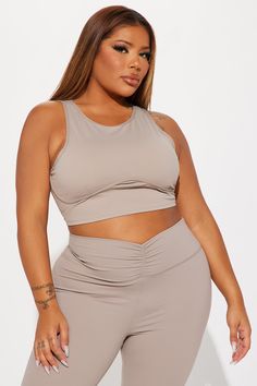 Available In Sage And Taupe. Super Soft Active Top Sleeveless High Neckline Underbust Binding Back Cut Out Ruching Back Tie Pair with "Pilates Girl Active Flare Pant" 75% Nylon 25% Spandex Imported | Pilates Girl Active Top in Taupe size 2X by Fashion Nova Compressive Sleeveless Activewear With Built-in Bra, Sleeveless High Stretch Sports Bra For Pilates, High Stretch Sleeveless Sports Bra For Pilates, Compression Sleeveless Tank Top, Bra Friendly, Fitted Sleeveless Crop Top For Pilates, Solid Color Fitted Sleeveless Sports Bra, Seamless Sleeveless Stretch Sports Bra, Seamless Stretch Sleeveless Sports Bra, Compressive Sleeveless Crop Top For Yoga