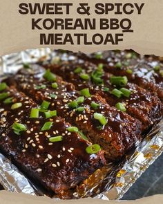 meatloaf with sesame seeds and green onions on top, in foil wrapper