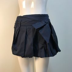 Love Brand Vintage But Nwt Dark Blue Pleated Mini Tennis Skirt With Bow Blue Pleated Skort For Workwear, Blue Pleated Skort For Work, Navy Pleated Skirt Bottoms For Spring, Navy Pleated Skirt For Spring, Blue Cotton Bottoms For Party, Chic Blue Skirt With Pockets, Chic Navy Skirt For Summer, Blue Cotton Party Bottoms, Chic Blue Skort For Night Out