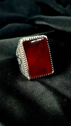 Beautiful size 9  hand made Bahraini sterling silver with large fire red color agate genuine Yemeni aqeeq that will be a strong statement piece Red Carnelian Rings With Polished Finish, Red Carnelian Ring With Polished Finish, Red Polished Carnelian Rings, Unique Red Ruby Ring Collectible, Unique Red Ruby Ring For Collectors, Formal Red Carnelian Ring, Red Carnelian Hallmarked Rings, Traditional Hallmarked Red Ruby Ring, Classic Red Agate Jewelry