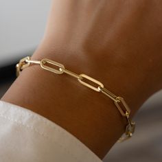 This paperclip bracelet is beautifully made. The minimalist design makes it a great layering piece, but also looks great on its own! We use a THICK plating of 14k Gold or Rhodium over 925 Sterling Silver Available in 6.25" or 6.75" + .5" Extension Chain Lobster Clasp Closure Nickel-free & Hypoallergenic Luxury Everyday Paperclip Bracelet With Rectangular Shape, Luxury Timeless Paperclip Chain Bracelet, Luxury Gold Minimalist Paperclip Bracelet, Luxury Timeless Gold Paperclip Bracelet, Luxury Minimalist Gold Paperclip Bracelet, Luxury Paperclip Chain Link Bracelet For Everyday, Luxury Timeless Paperclip Bracelet With Solid Links, Luxury Classic Paperclip Bracelet With Rectangular Links, Luxury Classic Paperclip Chain Link Bracelet