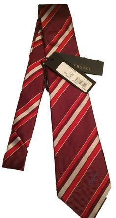 100% AUTHENTIC Burgundy, Red & Silver Gray Striped Men’s Silk Tie By Versace – Made in Italy Brand new with tags attached!!! 59” Long 100% Silk Please view pics which are considered part of the description and feel free to ask questions…thanks for looking! Designer Suit And Tie Accessories For Workwear, Designer Ties For Black Tie Events, Designer Ties For Formal Occasions, Silk Necktie, Gianni Versace, Burgundy Red, Silk Ties, Grey Stripes, Necktie