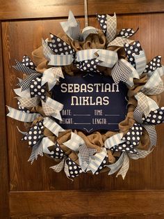 a wreath that says sebastian nikolas on it