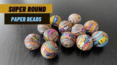 paper beads are stacked on top of each other with the words paper round in front of them