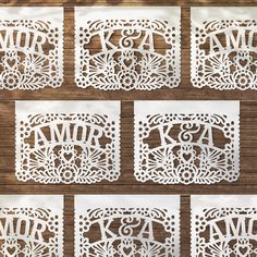 laser cut wedding guest bookmarks with monogrammed names and initials on them