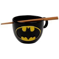 a batman bowl with chopsticks in it