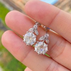 2CT Old European Cut and Marquise Cut Moissanite Dangle Drop Earrings Moissanite Bridal Stud Earrings S925 sterling silver Drop Earrings Women Earrings ♣ Stone Details ☛ Stone Weight & Size: 1.80CT (6.20 MM )Old European Cut Moissanite /0.2CTW Marquise Cut Moissanite  ☛ Stone Color ( White ) ☛ Clarity - VVS1 ☛ Luster: Excellent ☛ Make: High Quality ☛ Metal Change(10k/14k/18k White/Yellow/Rose Gold) ☛ Handmade item ★ Moissanite Guarantee :   Test By Diamond Tester Its Test Show Positive 100% I accept custom-making orders. please contact me if you need this service. All the jewelry in my store is handmade .it may take 2-3 weeks to finish. ♣ Buy with Warranty: ☛ 14 Days Money Back Guarantee; ☛Excellent Customer Service; ☛  Free Shipping and insurance WORLDWIDE; ☛ Free Gift Box. ♣ Shipping Det Bridal Earrings Studs, Sterling Silver Drop Earrings, Moissanite Earrings, Women Earrings, 19 Days, Earrings Women, Earrings Drop, Silver Drop Earrings, Marquise Cut