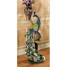 the peacock is standing next to two vases with flowers in them