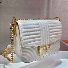 Size: 20.5cm*14cm*5cm It comes with Dust box, Care manual, Tag, and Paper bag. High-end White Flap Bag For Daily Use, White Clutch Flap Bag With Dust Bag, Luxury White Pouch Box Bag, High-end White Box Bag For Gifts, White Clutch Box Bag With Top Carry Handle, White Shoulder Bag With Gold-tone Hardware As Gift, Designer White Rectangular Case Bag, High-end White Square Shoulder Bag, White Luxury Clutch Bag