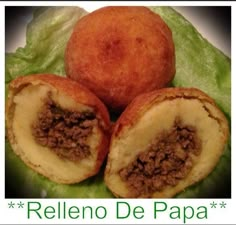 three pieces of food sitting on top of a leafy green surface with the words relleno de papaa written below it