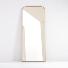 a large mirror sitting on top of a white counter