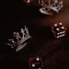 dices and crowns sitting on top of a table