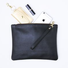 "This beautifully minimal zipper clutch / wristlet is created with buttery soft leather and a removable matching leather wrist strap. This is a perfect everyday or evening clutch for holding a cell phone, wallet, lipstick, compact, etc.. Available in SIX leather colors (black, navy blue, dark brown, red, taupe or burgundy). You also have the option of an UNLINED leather interior or a black linen blend LINED interior. Just choose the options you prefer from the drop down menus when purchasing thi Long Cotton Coat, Green Peacoat, Personalized Clutch, Leather Colors, Black Leather Clutch, Large Clutch, Cell Phone Wallet, Zippered Clutch, A Cell