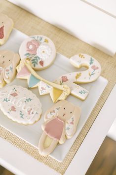 some decorated cookies are sitting on a tray