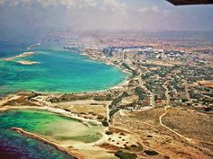 an aerial view of the ocean and coastline