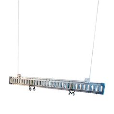 a long metal rack with several hooks hanging from it's sides and two wires connected to each other