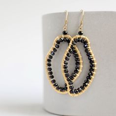 The abstract shapes in our freestyle collection are each completely unique.- Black spinel gemstones- 2 1/2" long- French hooks- 14k gold plated .925 fine Italian sterling silver- Made in the USA in our NYC studio- Packaged in a gift box- Free shipping on US ordersHandmade to last. Our unique gold plating technique makes our jewelry tarnish resistant. The nature of natural gemstones makes each style one-of-a-kind. Modern Twist Dangle Jewelry For Gifts, Modern Teardrop Wire Wrapped Jewelry, Modern Wire Wrapped Teardrop Jewelry, Gold Freeform Earrings As Gift, Gold Freeform Earrings For Gift, Adjustable Black Spinel Jewelry For Gifts, Teardrop Earrings With A Modern Twist As A Gift, Modern Twist Teardrop Earrings Gift, Handmade Modern 14k Gold Filled Jewelry