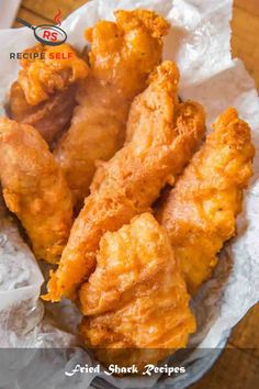 some fried food is in a basket on the table and it looks like they are ready to be eaten