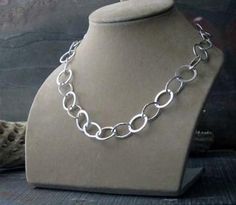 "Our sterling silver chunky handmade chain. Completely hand fabricated and hammered using thick wire. At an 18\" length it weighs nearly a full troy ounce of silver. The circles have been hammered smooth while the ovals have been given a textured appearance adding interest to the design. Circles measure about 15mm diameter Ovals measure about 16x11mm Made to order Θ Allow up to 14 business days before shipment Θ VISIT OUR SHOP: http://PoseidonsBooty.etsy.com SHOP POLICIES: http://www.etsy.com/sh Chunky Oval Link Necklace, Silver Chunky Chain Oval Necklace, Silver Necklace With Chunky Oval Chain, Silver Oval Necklace With Chunky Chain, Chunky Chain Necklace, Prescott Az, Handmade Chain, Chunky Chain Necklaces, Sterling Silver Chain Necklace