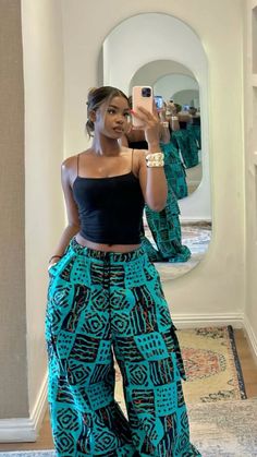 Trendy Nigerian Outfits, Ankara Trouser Styles For Women, Baggy Pants Women Outfit, Ankara Street Style, Africa Street Style, Baggy Ankara Trouser, Green Ankara Styles For Women, Ankara Combat Trousers Women Outfit, Kenyan Outfits