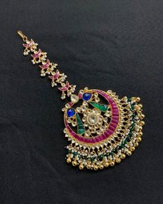 *It's Handmade Kundan Mangtikka for Indian Brides. *It's made from Silver n Copper with Pink,Green and White Kundan Stones Settings with 22k gold Plating as shown in picture. *It's 2 Inch size. *Our all jewelry is made from semiprecious stones and beads. *WARRANTY: ITS GENUINE HANDMADE JEWELRY AND WE ARE GIVING LONG LIFE WARRANTY FOR OUR ALL ITEMS. All of our Kundan Jewelry is 100% handmade with ancient Kundan stone setting method using silver foils. It is one of the most favorable jewelry since Kundan Bridal Accessories With Tilla For Marriage, Tilla Tikka For Marriage And Festivals, Traditional Bridal Accessories With Stone Work For Wedding, Bollywood Bridal Accessories For Marriage, Traditional Wedding Bridal Accessories With Stone Work, Festive Bridal Accessories With Tilla For Marriage, Traditional Cutdana Dupatta For Marriage, Traditional Bridal Accessories With Stone Work For Marriage, Traditional Festive Wedding Hair Accessories