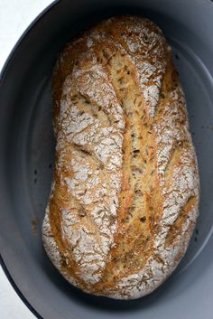 a loaf of bread sitting in a bowl