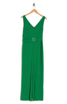 Set the trend in this sleeveless crepe jumpsuit featuring an attached belt with a sparkling buckle and elegant leg overlays. V-neck Sleeveless Unlined 96% polyester, 4% spandex Hand wash, line dry Made in the USA Model stats: 5'10" height, 32" bust, 25" waist, 36" hip. Model is wearing size Small. Elegant Spring Jumpsuits And Rompers With Belt Loops, Sleeveless Belted Jumpsuit For Date Night, Belted Sleeveless Jumpsuits And Rompers For Date Night, Sleeveless Belted Formal Jumpsuits And Rompers, Sleeveless Belted Formal Jumpsuit, Sleeveless Belted Jumpsuits And Rompers For Evening, Sleeveless Belted Jumpsuit For Formal Occasions, Formal Belted Sleeveless Jumpsuits And Rompers, Sleeveless Belted Jumpsuit For Party