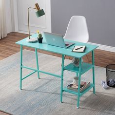 a laptop computer sitting on top of a blue desk next to a chair and lamp