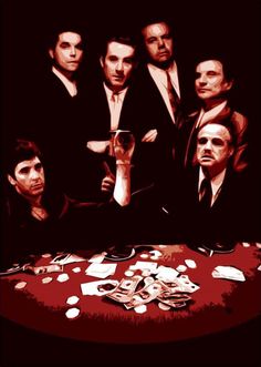 a group of men in suits sitting at a table with cards and money on it