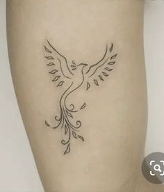 a small tattoo on the leg of a woman