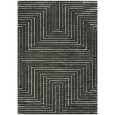 an area rug with grey and white lines on it