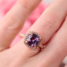 Gorgeous Classic Cushion Cut Ceylon Purple Sapphire Ring ►Base Metal: Sterling Silver (925) ►Plating: 14K Rose Gold ►Accented with simulated diamonds (CZ) ►Average band width: 1.9 mm Center Stone: Sapphire Color: Purple Gemstone Creation: 100% Genuine Lab-Grown Sapphire Stone Cut: Cushion Size: 8.0 x 8.0 mm Carat Weight: 2.5 ct. (approx.) Hardness: 9 (Mohs scale) ►Please be aware that plated jewelry can wear off over time, if this is a concern we would suggest going with the sterling silver or s Elegant Purple Birthstone Ring, Purple Sapphire Birthstone Ring For Promise, Elegant Purple Gemstone Birthstone Ring, Heirloom Purple Sapphire Ring For Anniversary, Purple Sapphire Ring With Gemstone Accents As Gift, Unique Gemstone Engagement Rings, Morganite Engagement Ring Oval, Ceylon Sapphire Ring, Purple Sapphire Ring