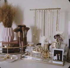 a table topped with lots of different types of cosmetics and personal care items on top of it